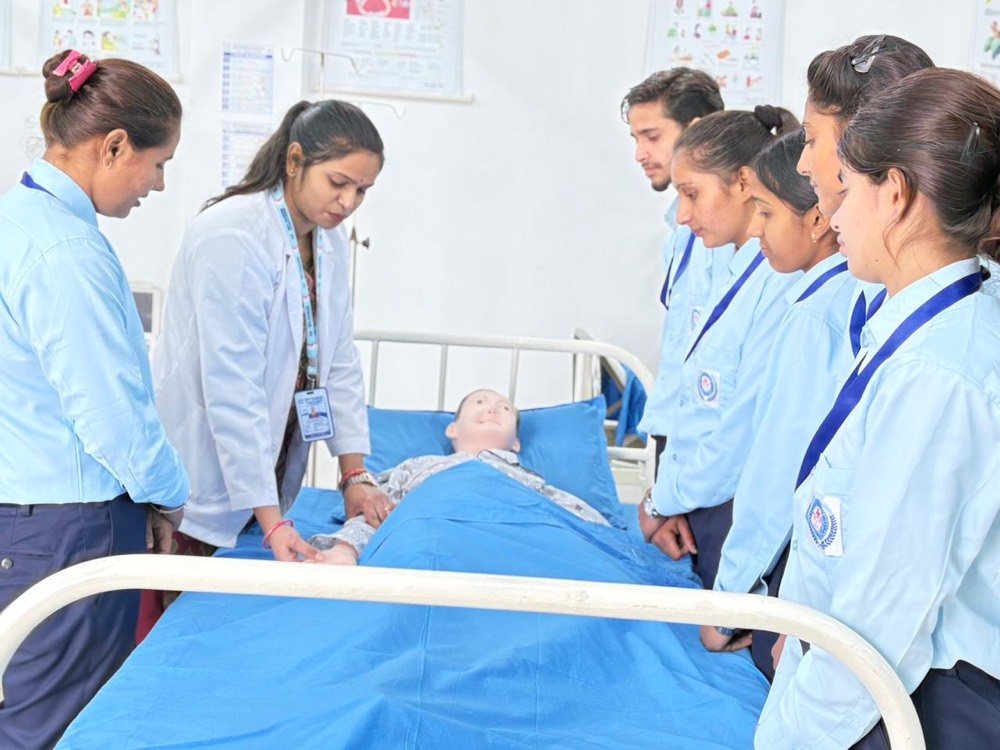 Students practising in the nursing skills laboratory